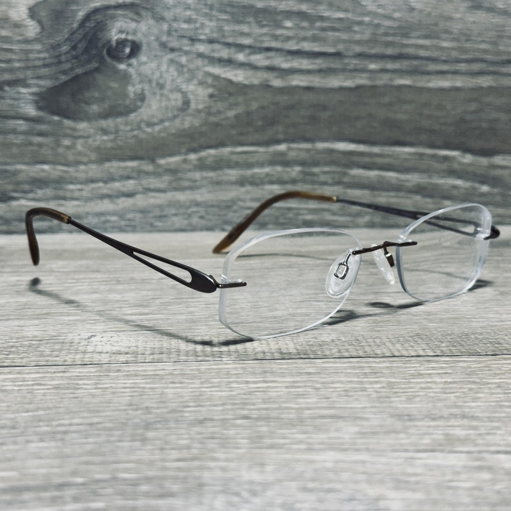 Charmant CH10934S Eyeglass Frames 52-17-135 Brown Titanium Mens Rimless